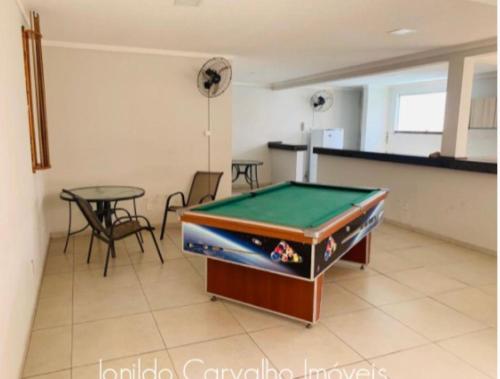 a pool table in a room with a table at 507 - Apto completo p temporada ou negócios - PVH in Porto Velho