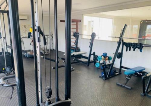 a gym with several treadmills and machines in a room at 507 - Apto completo p temporada ou negócios - PVH in Porto Velho