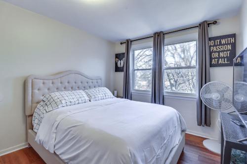 a bedroom with a white bed and a window at Cozy Easton Condo Near Historic Downtown in Easton