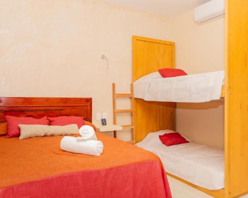 מיטה או מיטות בחדר ב-Hotel Nojoch che