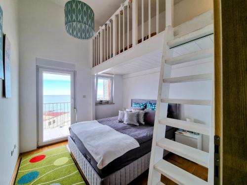 Ένα ή περισσότερα κρεβάτια σε δωμάτιο στο Gina Seaview