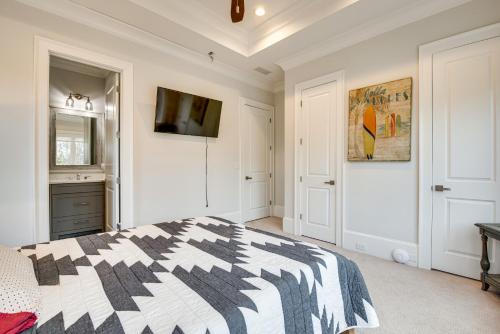 a white bedroom with a black and white bed at Sprawling Suwanee Home Theater, Pool, Hot Tub! in Suwanee
