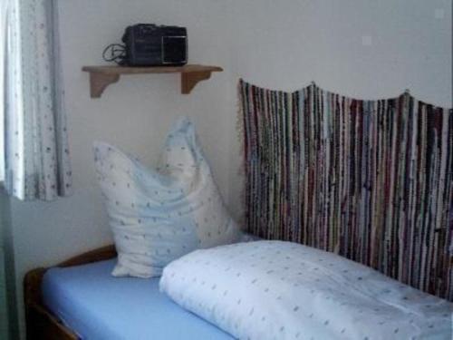 A bed or beds in a room at Wohnung Haus Falkenstein Nr 4 mit Balkon in Oberstdorf-Tiefenbach - b48484