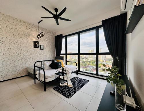 a bedroom with a bed and a ceiling fan at New 2BR or 3BR Homey Getaway stay 7 to 10 pax at Urban Suites, Georgetown by URBAN STAYCATION LOD in Jelutong