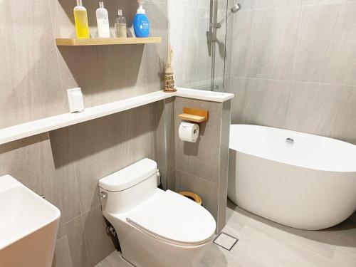 a bathroom with a white toilet and a sink at Gyeongju Hanok Sohwa in Gyeongju