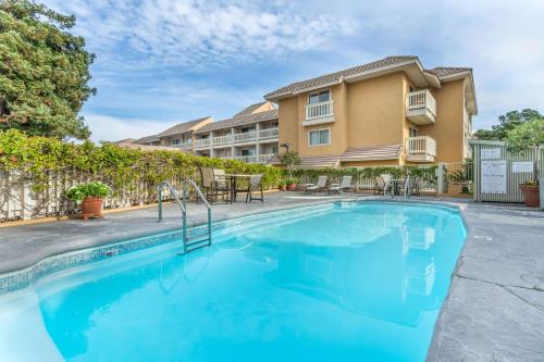 a swimming pool in front of a building at Best Western Plus Monterey Inn in Monterey