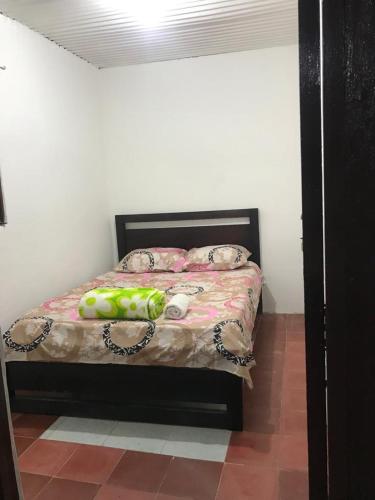 a bedroom with a bed with a chain around it at CASA HOSTAL GUADALUPE in Guadalupe