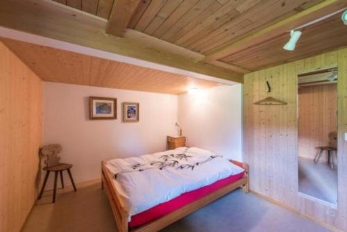 a bedroom with a bed in a room at Haus Eberli-Bussmann - b48553 in Giswil
