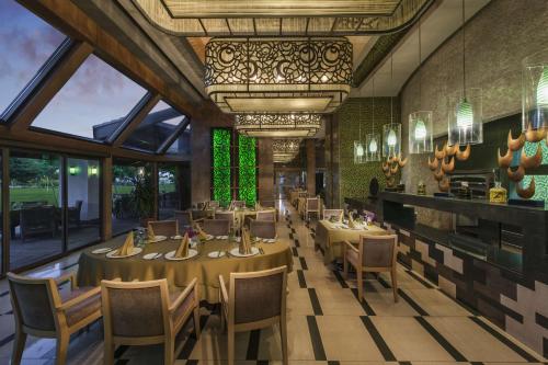 a rendering of a restaurant with tables and chairs at Hilton Dalaman Sarigerme Resort & Spa in Dalaman