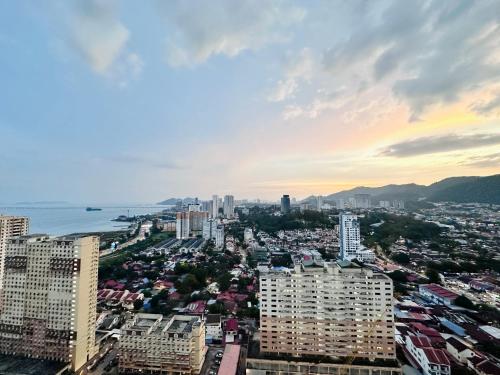 an aerial view of a city with buildings at New 2BR or 3BR Homey Getaway stay 7 to 10 pax at Urban Suites, Georgetown by URBAN STAYCATION LOD in Jelutong