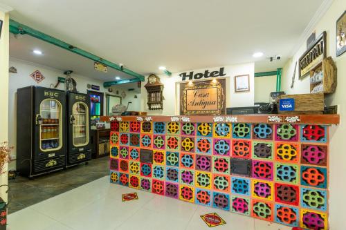 a store with a lot of different colored plates on display at Hotel Casa Antigua in Bogotá