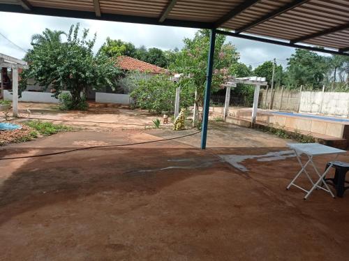 an empty parking lot with a basketball hoop at Fazendinha in Itapuranga