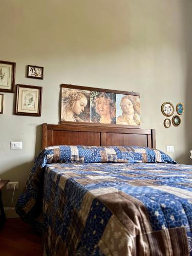 a bedroom with a bed with a blanket on it at Albero Mago in Florence