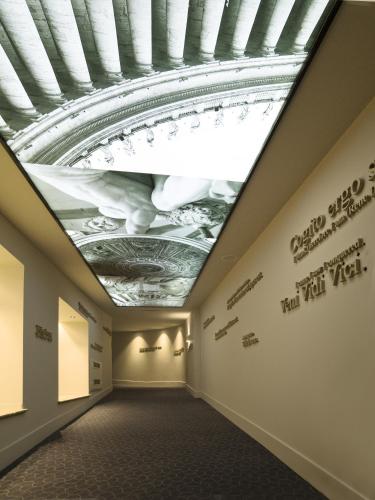 a hallway with a ceiling with a painting on it at A.Roma Lifestyle Hotel in Rome