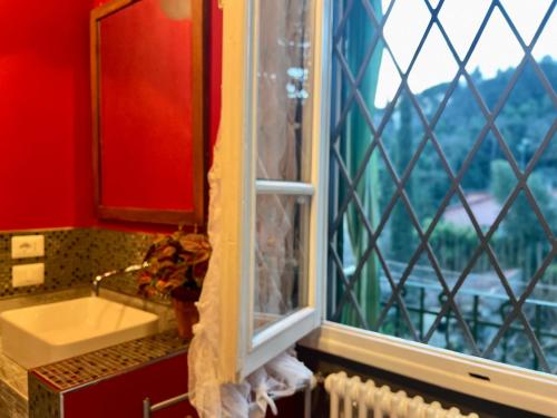 a bathroom with a sink and a window at Albero Mago in Florence
