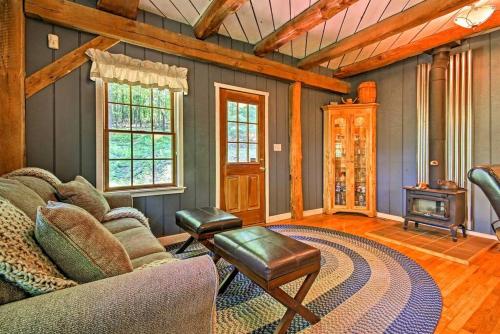 a living room with a couch and a fireplace at Bear's Eye View - Mountain Retreat w/ Hot Tub! in Acme
