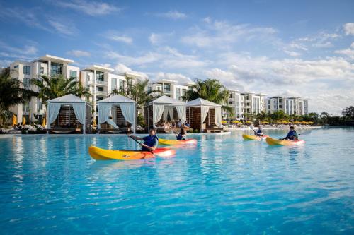 a group of people kayaking in the water at a resort at Evermore Orlando Resort in Orlando