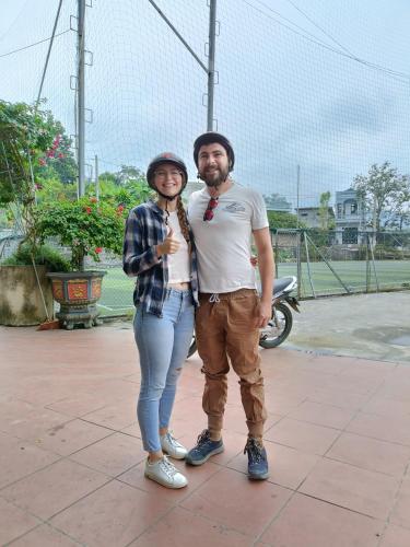 a man and a woman standing next to each other at GiaBinh Homestay in Cao Bằng