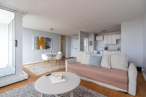 a living room with a couch and a table at Bright DT Apt #7A, Amazing View in Halifax