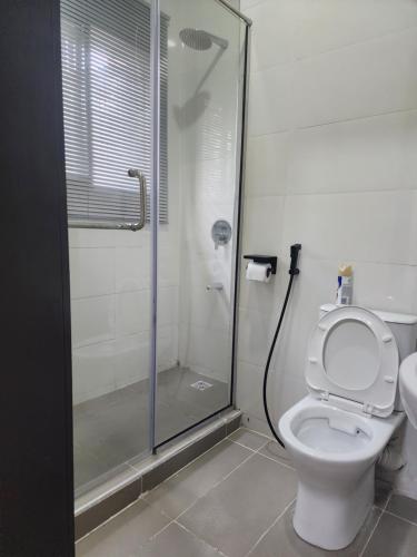 a bathroom with a shower and a toilet at Wonder court 2 lekki phase1 in Lekki