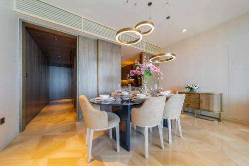 a dining room with a table and chairs at *Five Palm* 2bdr Private Beach in Dubai