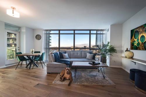 a living room with a dog laying on the floor at Downtown Toronto Condo Parking Sleeps 4 Balcony Walk to Lake in Toronto