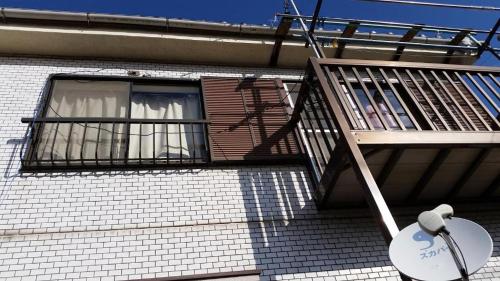 a balcony on a building with a window at Mason1, Direct to Narita,Haneda AirPort, Disney,Asakusa,Skytree Tower,Tokyo,Ginza All Direct, D in Kamagaya