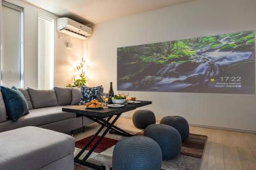 a living room with a couch and a table at エクセルシア in Osaka