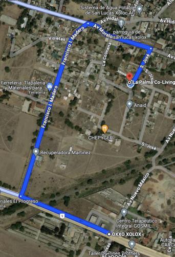 a map of a city with a blue at La Palma Coliving in San Lucas Xoloc