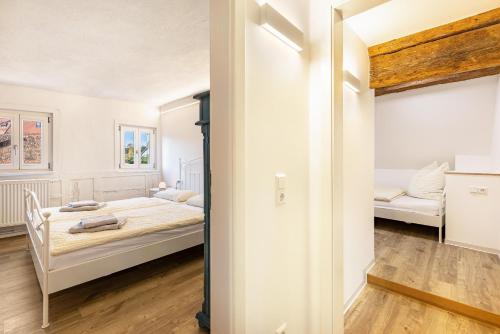 a bedroom with a bed in a room at Ferienwohnungen Metzgerpost in Altensteig