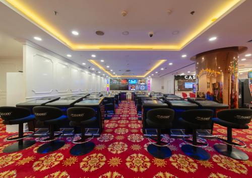 a conference room with a row of chairs and a red carpet at Havana Nha Trang Hotel in Nha Trang