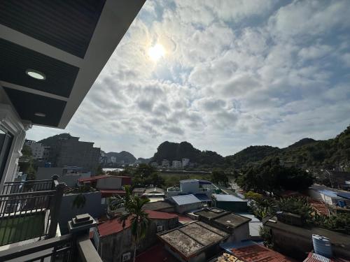 a view from a balcony of a city with mountains at Cat Ba Seoul 2 Hotel & Apartment in Cat Ba