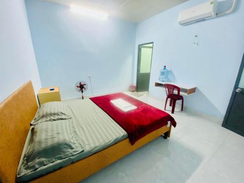 Cama o camas de una habitación en Nhà Nghỉ Đoàn Gia