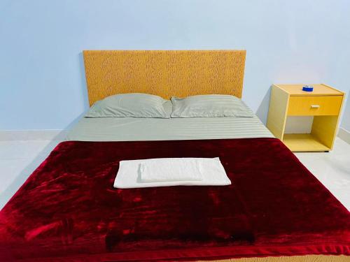 Un pat sau paturi într-o cameră la Nhà Nghỉ Đoàn Gia