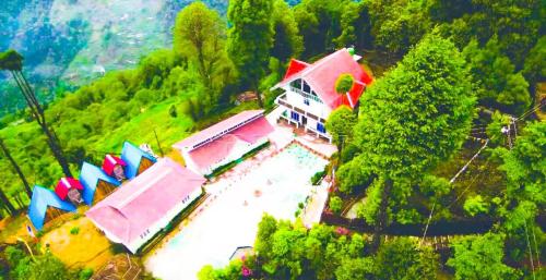 an aerial view of a building with umbrellas at BODHI VILLA in Sombāri