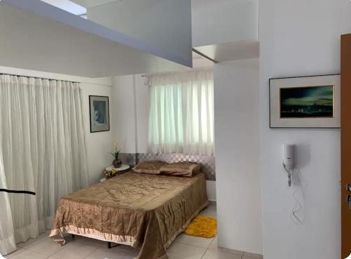 Postelja oz. postelje v sobi nastanitve Studio Brasilia ótima localização