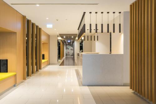 a hallway of an office building with a reception counter at IMSA Group in Melbourne