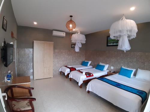 Postel nebo postele na pokoji v ubytování An Bang Beach Town Homestay