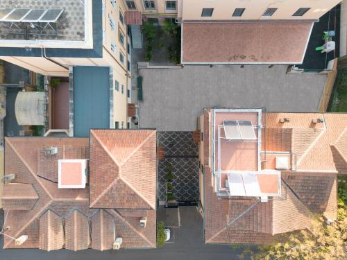 an overhead view of roofs of buildings in a city at Casa San Giuseppe in Rome