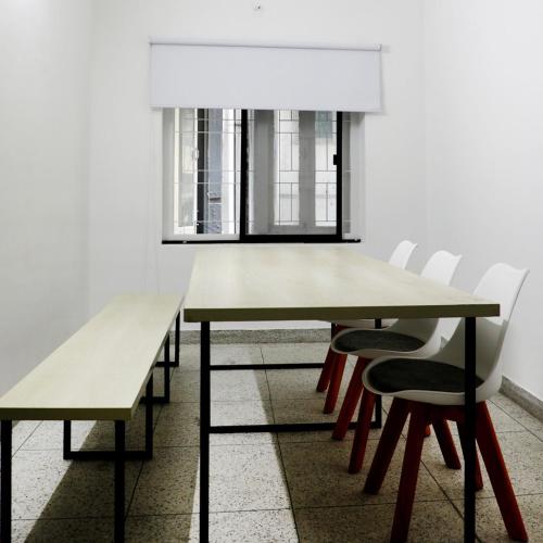 a dining room with a table and chairs at Yess by bti - Male Hostel in Dhaka