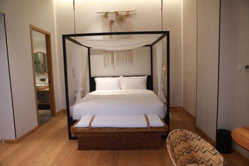 a bedroom with a bed with a canopy at Shanghai Pudong Airport Moonlo Hotel - Pet Friendly in Shanghai