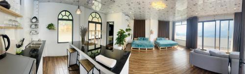a living room with a couch and a table at Catcat Garden House in Sa Pa