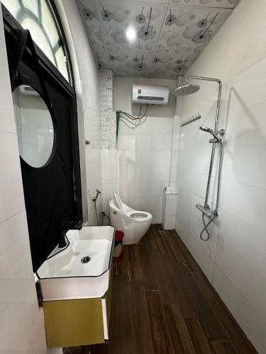 a bathroom with a sink and a toilet at Catcat Garden House in Sa Pa
