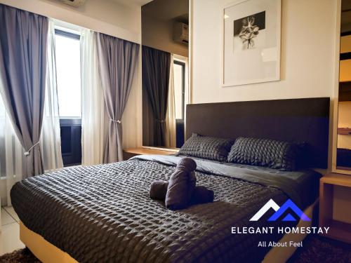 a bedroom with a large bed in front of a window at 1 Tebrau By Elegant Johor Bahru in Johor Bahru