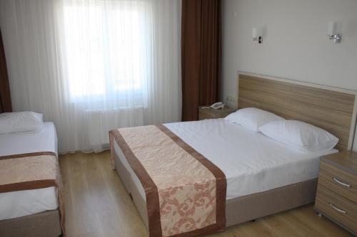 Cama o camas de una habitación en Hotel Ejder