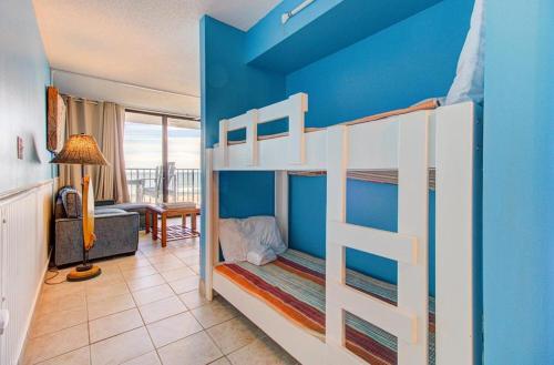 a bedroom with two bunk beds in a room at 0305 Mako Your Dreams Come True by Atlantic Towers in Carolina Beach