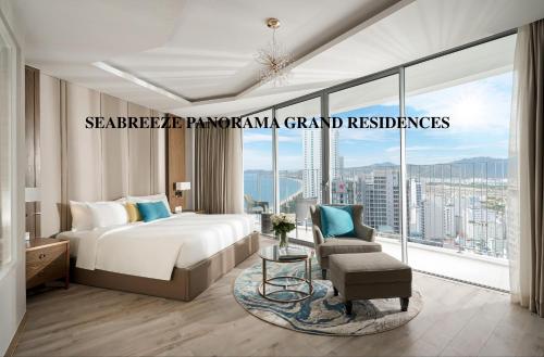 a bedroom with a bed and a large window at SeaBreeze Panorama Grand Residences in Nha Trang