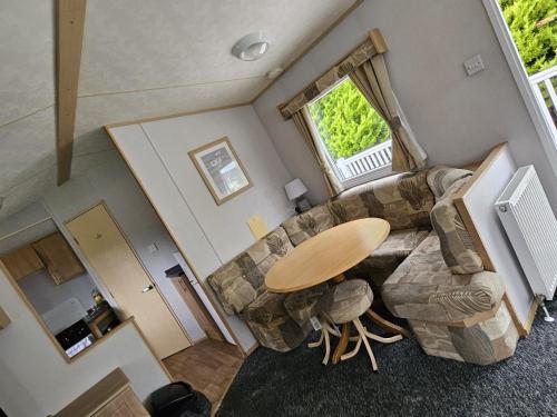 an overhead view of a living room with a table and a couch at 53 Kingsgate Lower Hyde in Shanklin