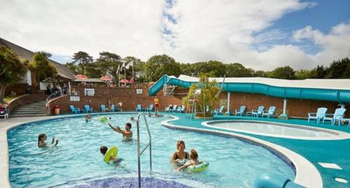 a group of people playing in a swimming pool at 53 Kingsgate Lower Hyde in Shanklin