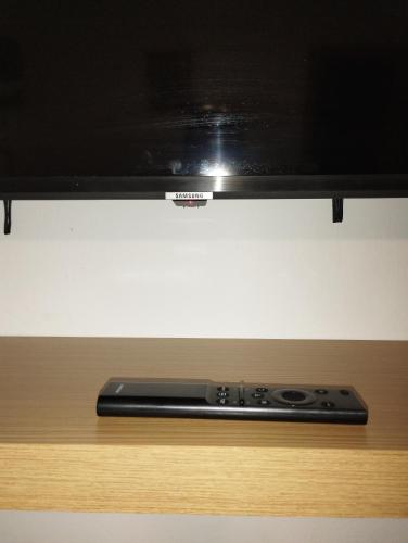 a television sitting on top of a wooden table at Benidorm Center Centro in Benidorm